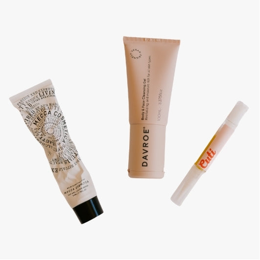 flat lay of body care products for The Beauty Exchange on a neutral background, includes, nailcare, moisturisers, hand care and body balms 